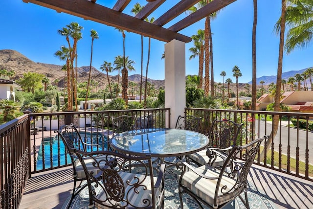 balcony with a mountain view and a pergola