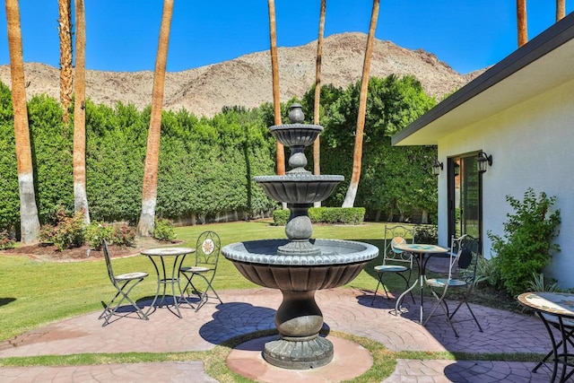 view of patio / terrace featuring a mountain view