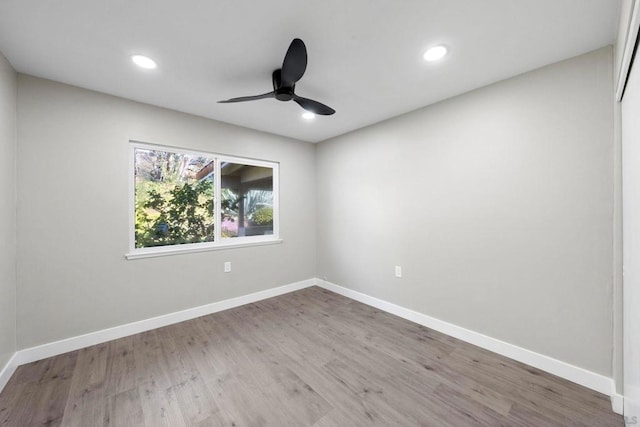 empty room with wood-type flooring and ceiling fan