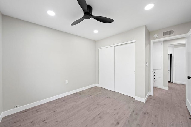 unfurnished bedroom featuring a closet, ceiling fan, and light hardwood / wood-style floors