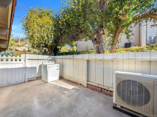 view of patio / terrace featuring ac unit and washer / clothes dryer