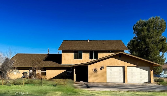 back of property featuring a garage