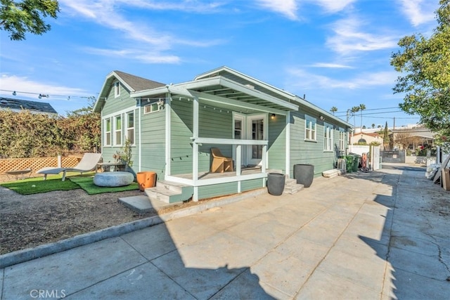 rear view of property featuring a patio