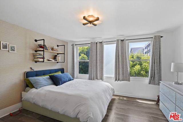 bedroom featuring dark wood-type flooring