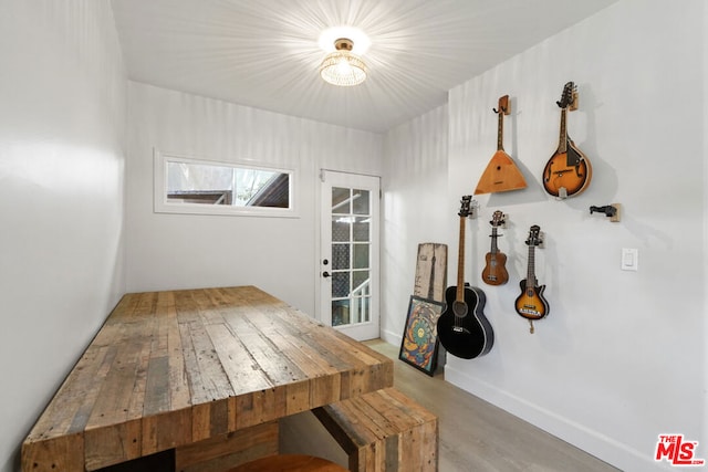 dining space with hardwood / wood-style floors