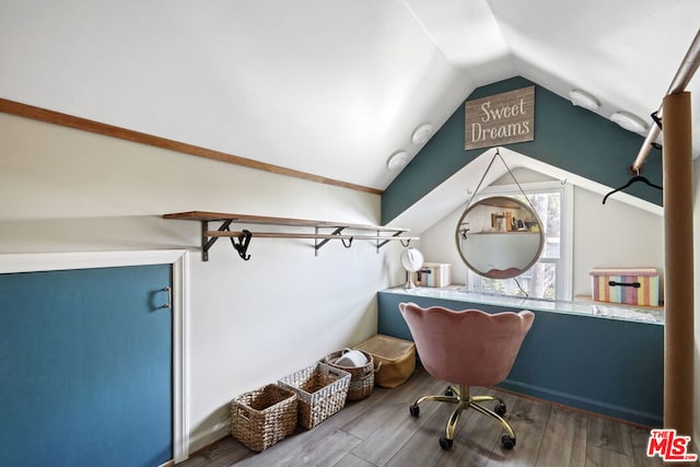 interior space with hardwood / wood-style floors and lofted ceiling