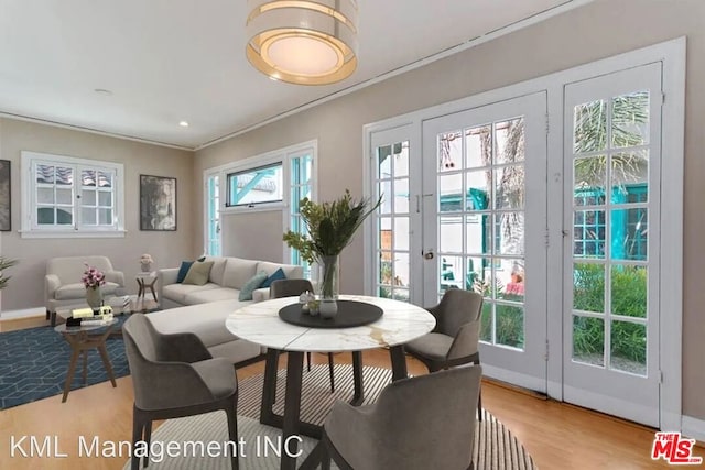 dining area featuring light hardwood / wood-style floors and plenty of natural light