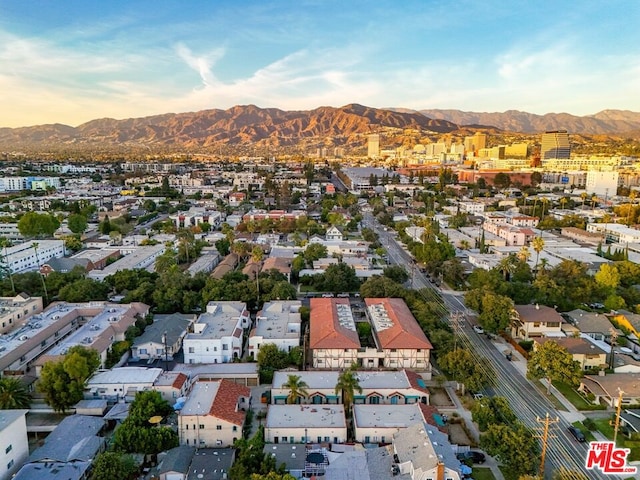 birds eye view of property with a mountain view