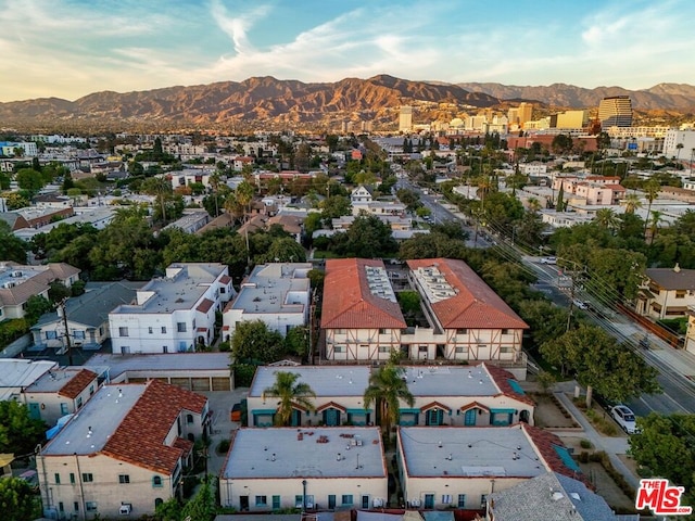 birds eye view of property with a mountain view