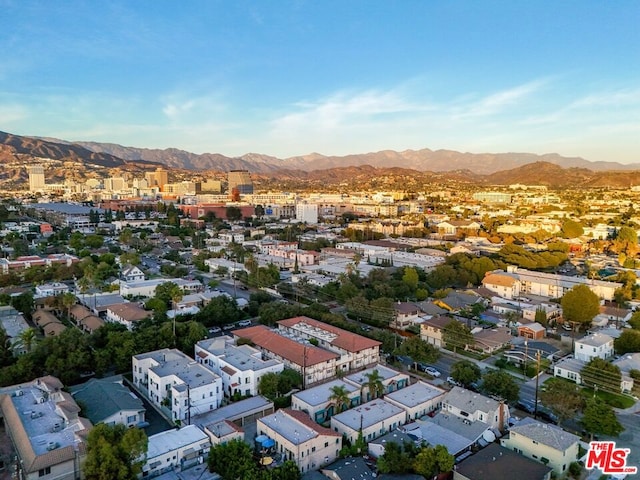 birds eye view of property featuring a mountain view