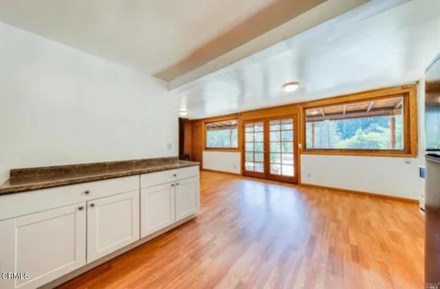 interior space featuring french doors and light hardwood / wood-style flooring