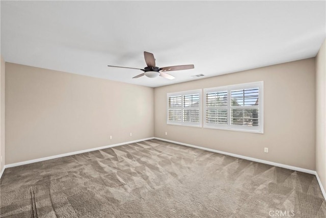 empty room featuring ceiling fan and carpet flooring