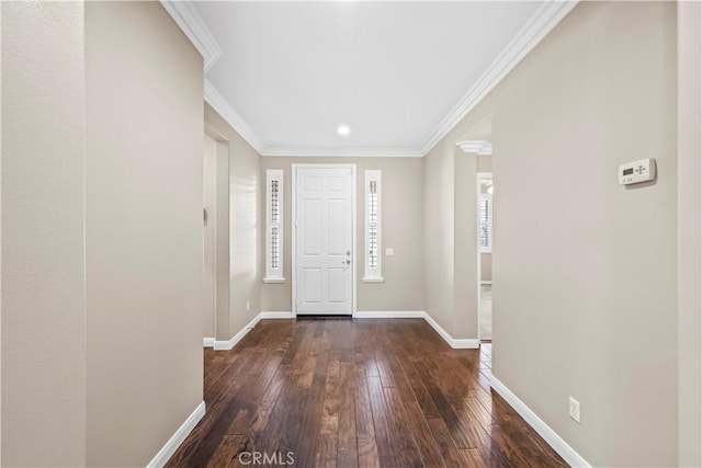 foyer featuring dark wood-type flooring and ornamental molding