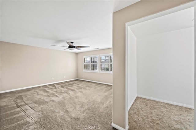 carpeted empty room with ceiling fan