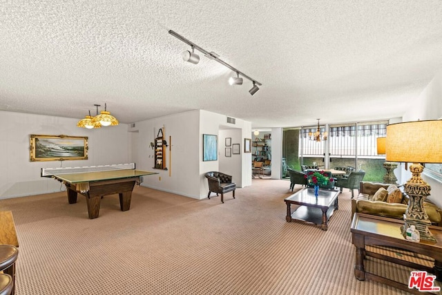 playroom with a textured ceiling, pool table, track lighting, and carpet flooring