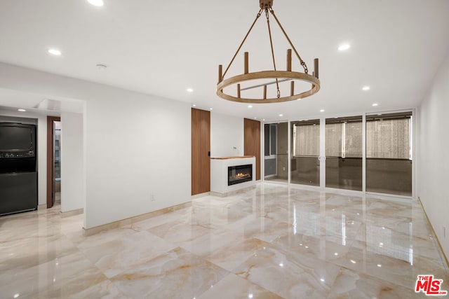 unfurnished living room featuring floor to ceiling windows