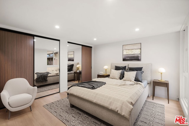 bedroom with light wood-type flooring