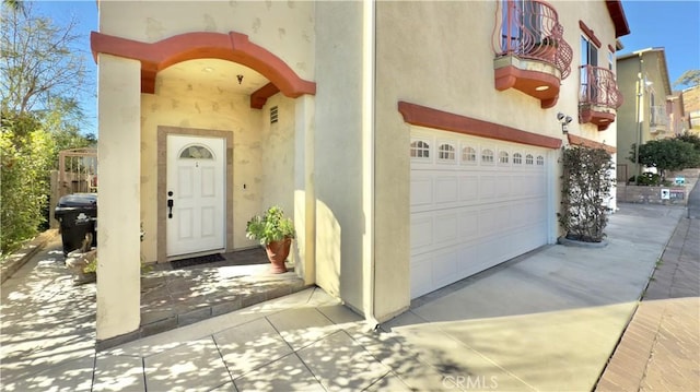 view of exterior entry with a garage