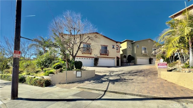 mediterranean / spanish-style house featuring a garage