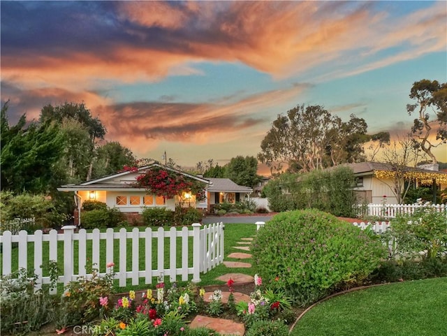 view of front of property with a lawn