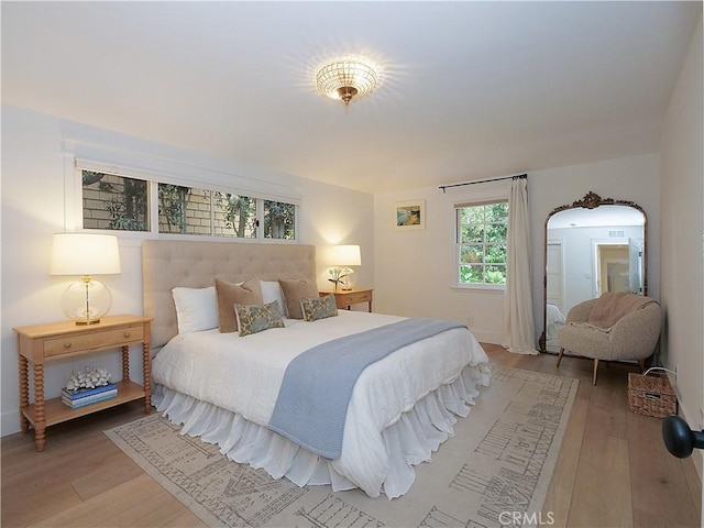 bedroom featuring wood-type flooring