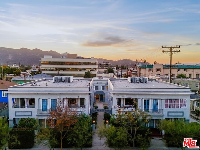 outdoor building at dusk featuring a mountain view