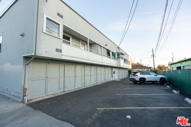 view of parking featuring a garage