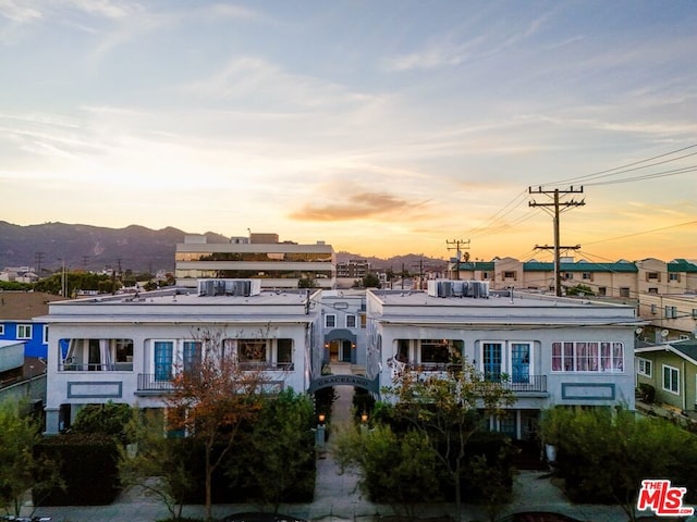 view of outdoor building at dusk