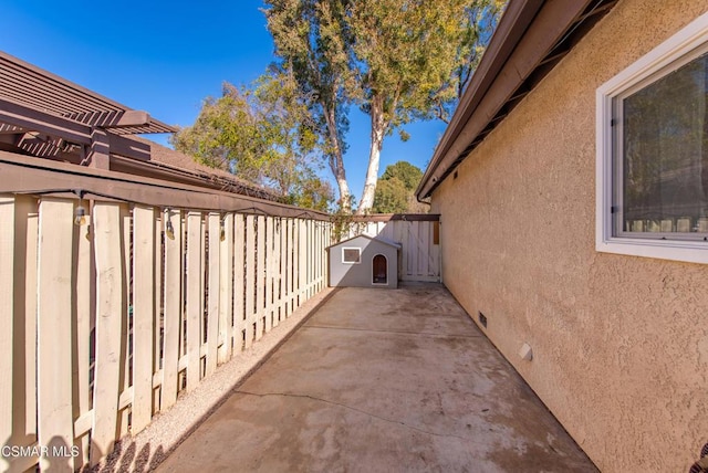 view of side of home with a patio area