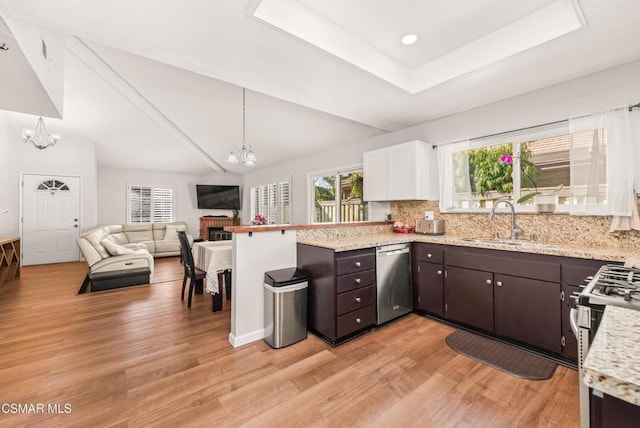 kitchen featuring dark brown cabinetry, white cabinetry, and a chandelier