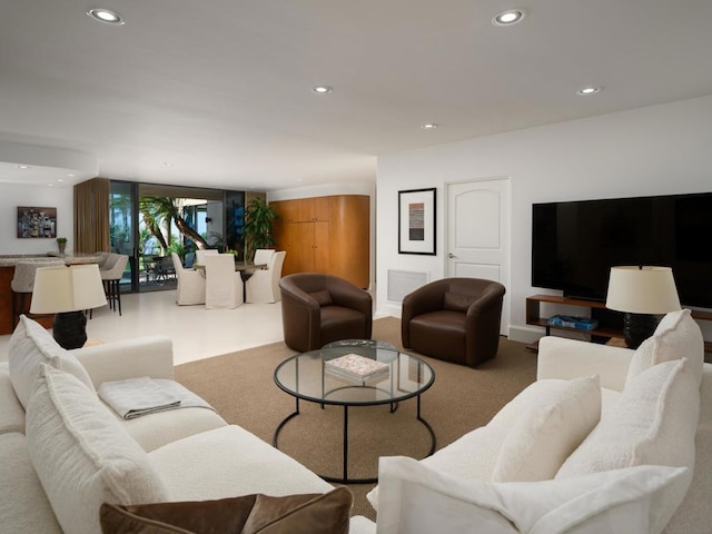 living room featuring a wall of windows