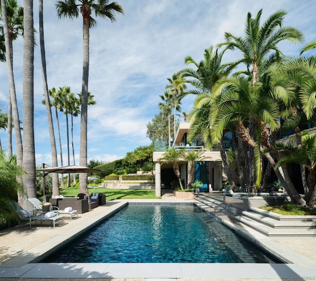 view of swimming pool featuring a patio area and an outdoor hangout area