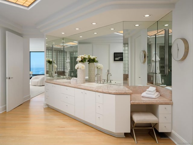 bathroom with vanity and hardwood / wood-style flooring