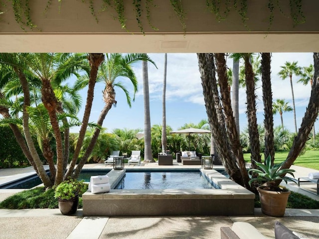 view of swimming pool with a patio area and an outdoor hangout area