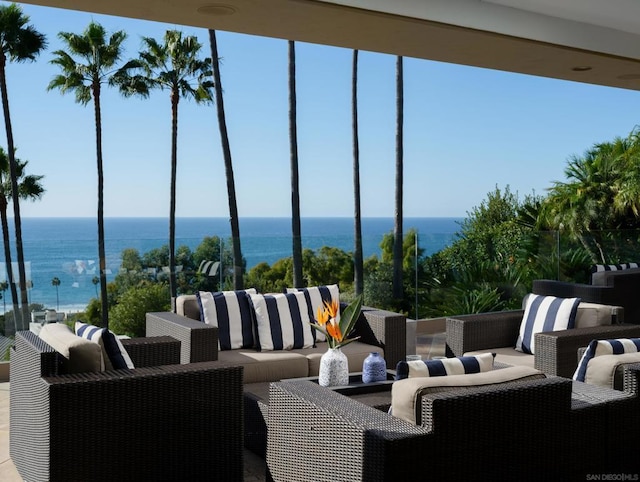 view of patio / terrace with an outdoor living space and a water view