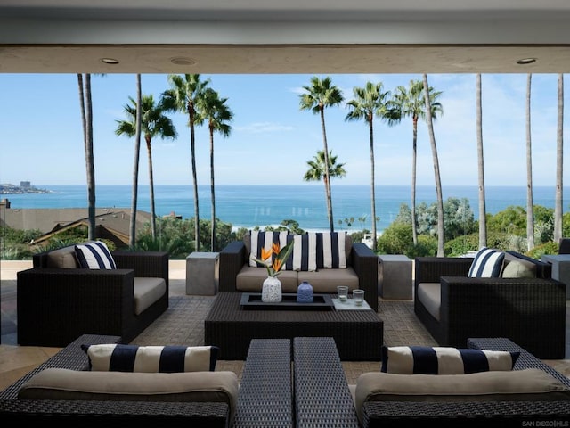 view of patio / terrace featuring an outdoor living space and a water view