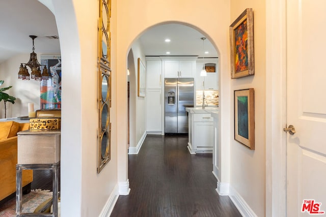 hallway with dark hardwood / wood-style floors