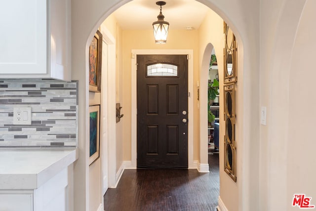 entrance foyer with dark hardwood / wood-style floors