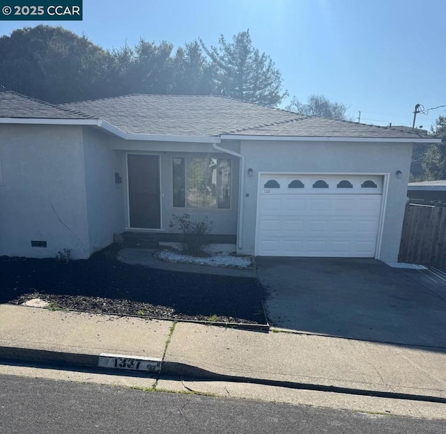 single story home featuring a garage