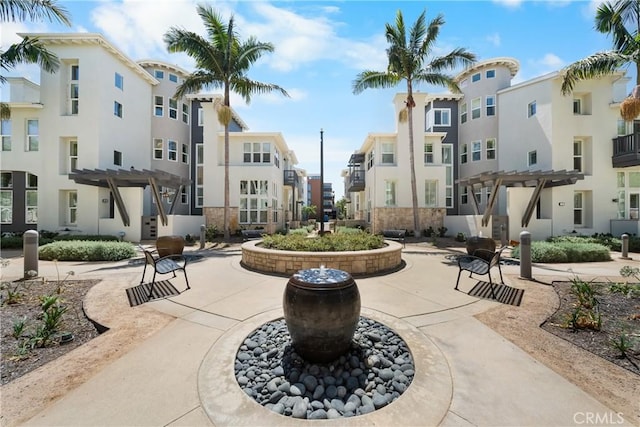 view of community featuring a residential view and a pergola