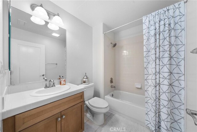 full bathroom with toilet, shower / bath combination with curtain, tile patterned floors, and vanity