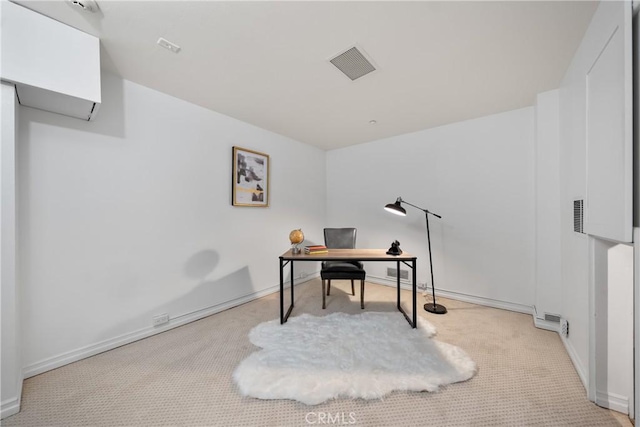 office with light colored carpet, visible vents, and baseboards