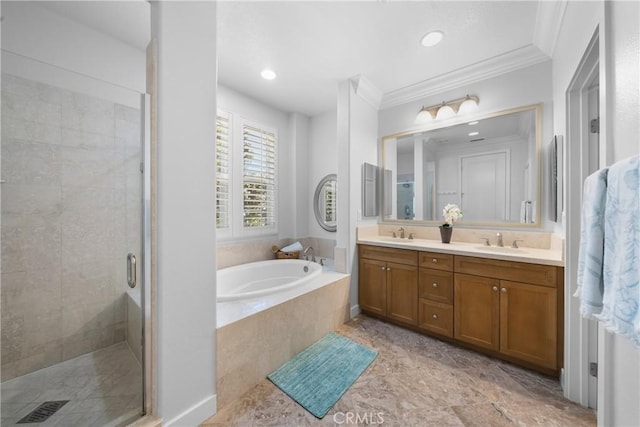 bathroom with vanity, ornamental molding, and separate shower and tub