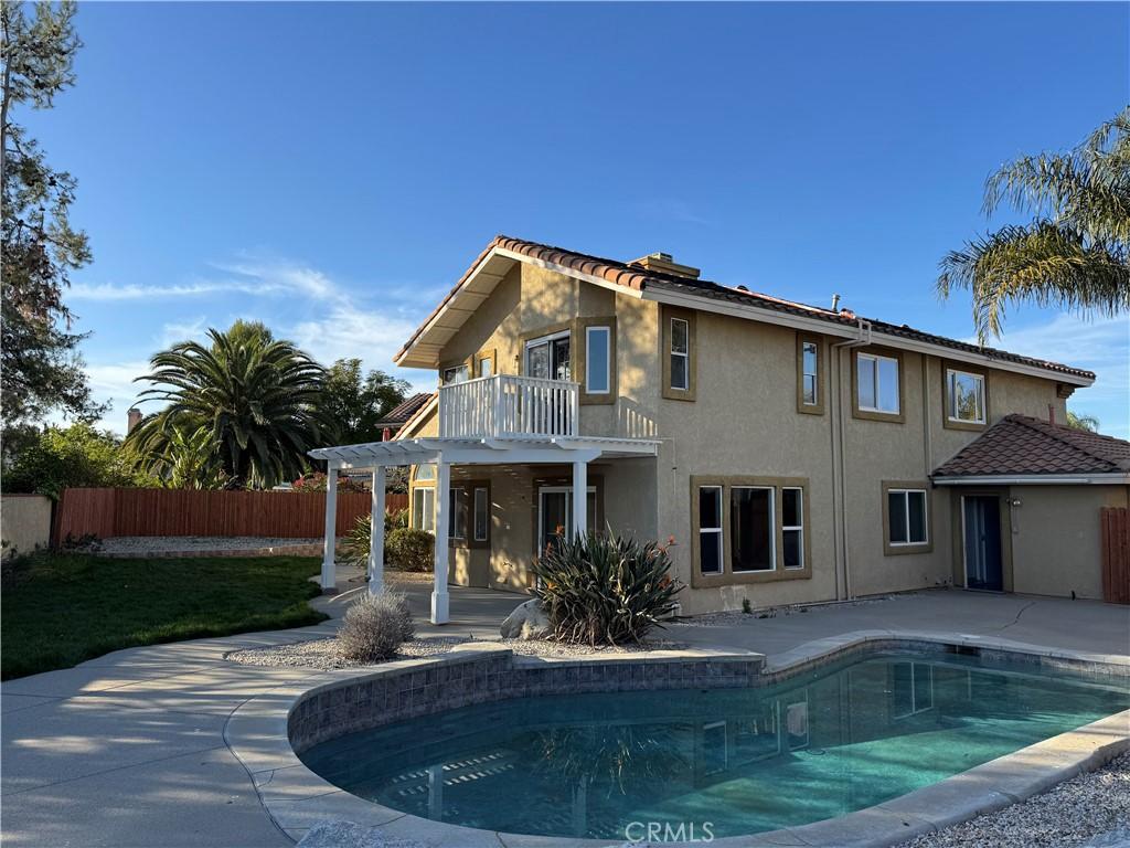 23835 Sweet Pea Ct, Murrieta, CA 92562 - view of swimming pool featuring a patio, a fenced in pool, fence, and a pergola