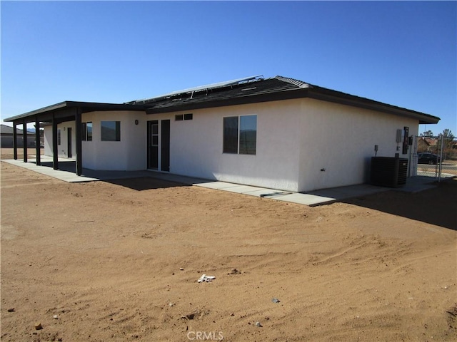 back of house with a patio and central air condition unit