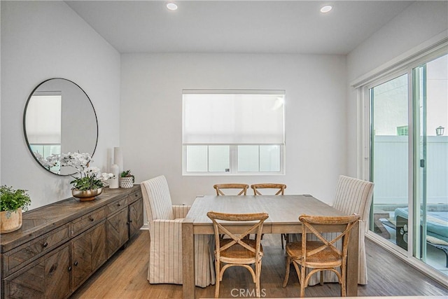 dining space with light hardwood / wood-style flooring