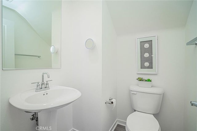 bathroom featuring sink and toilet