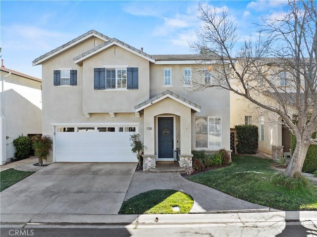 view of property with a garage and a front lawn