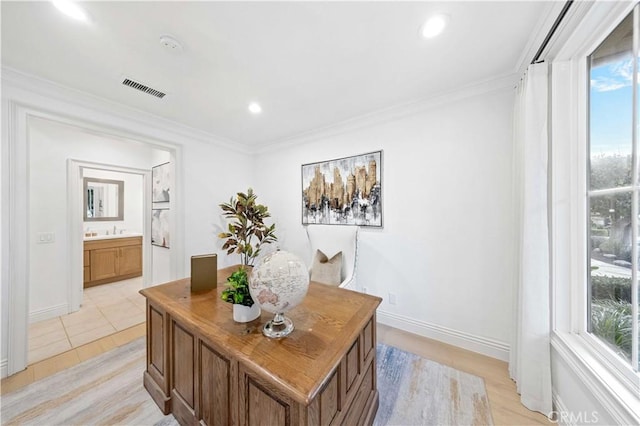 tiled home office with crown molding and sink