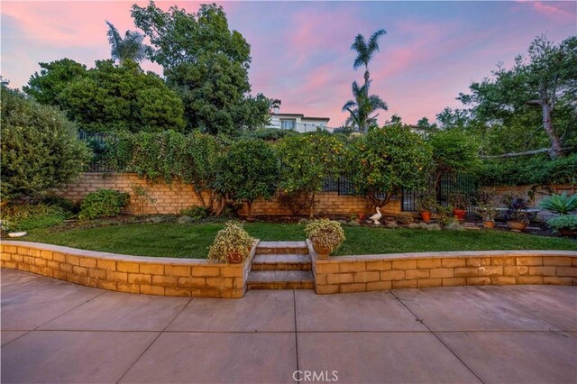 patio terrace at dusk with a lawn